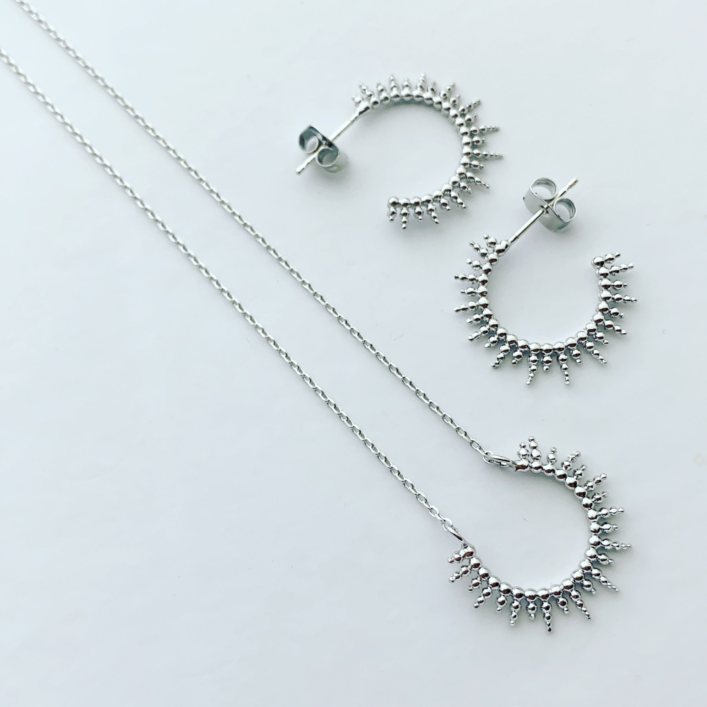 Dotty Sunburst Arc Necklace